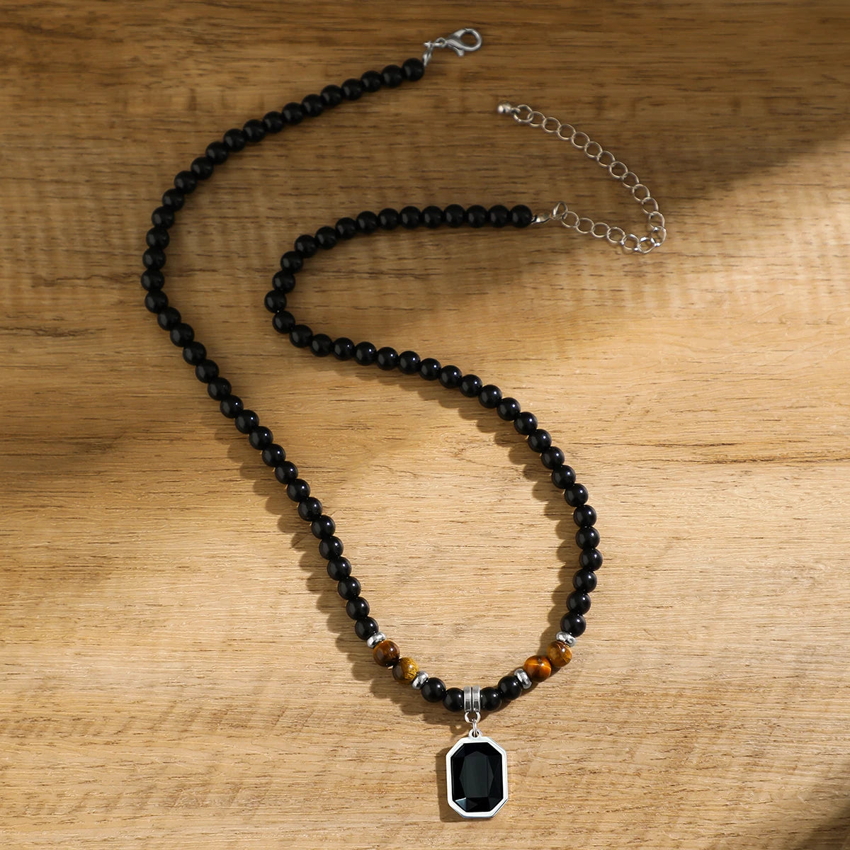 Square pendant necklace with black beads 